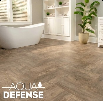 A bathtub in a room with waterproof vinyl flooring