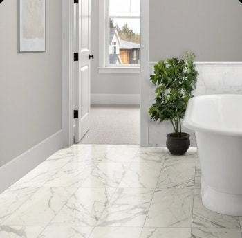 A bathroom with tile that looks like stone