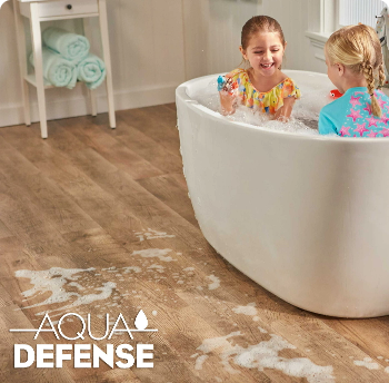 Kids playing in a tub and splashing water onto waterproof laminate flooring